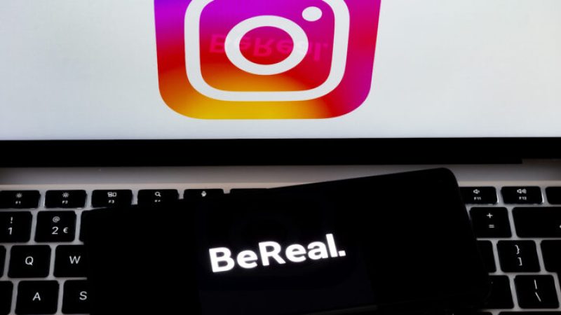 Bereal logo seen on smartphone and instagram logo on the laptop. BeReal is a social media app. Stafford, United Kingdom, August 2, 2022.